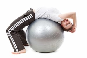 exercising_on_a_gym_ball_198632